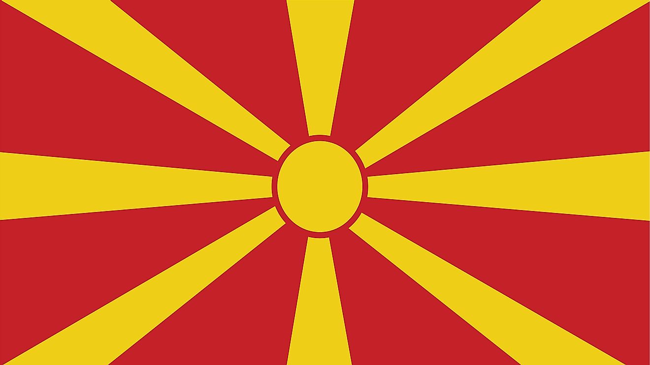 The national flag of Macedonia consists of stylized yellow sun centered on red field with its eight broadening yellow rays extending out in all directions and end at the edges of the flag
