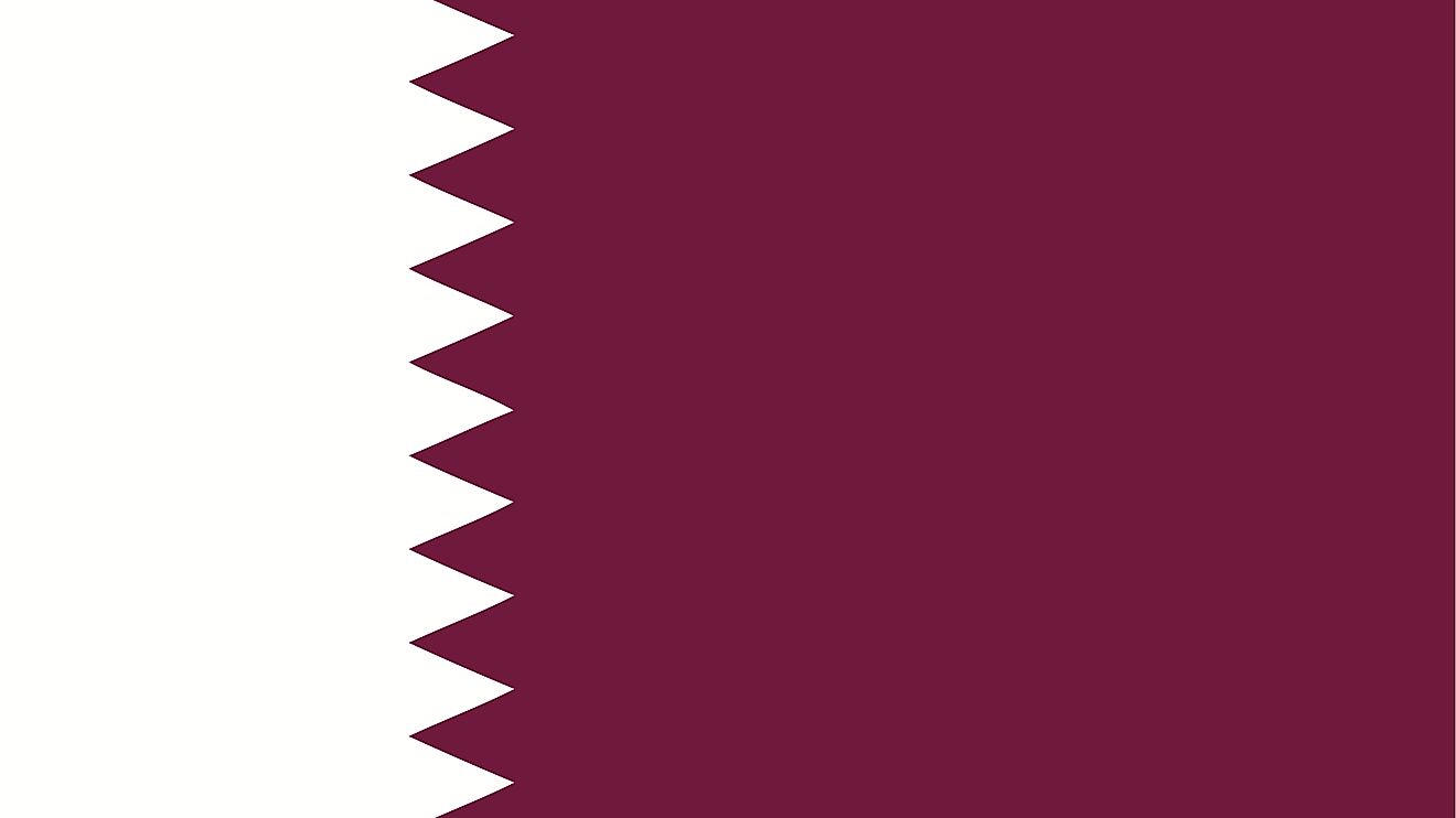 The National Flag of Qatar features a wider maroon band on the fly side, with a broad white serrated band (nine white points) on the hoist side of the flag.