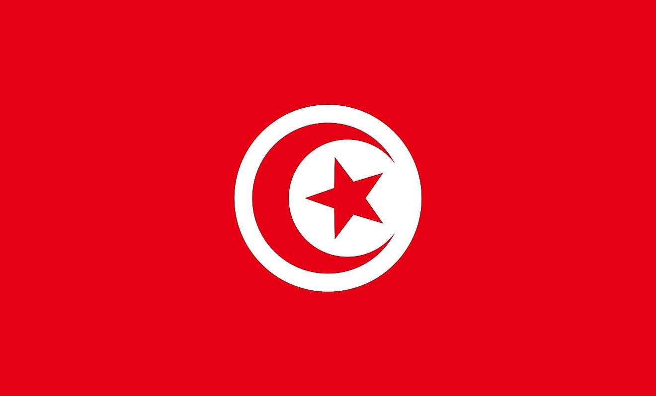 The National Flag of Tunisia is rectangular in shape and features a red background with a white disk at the center, that bears a red crescent nearly encircling a red five-pointed star.