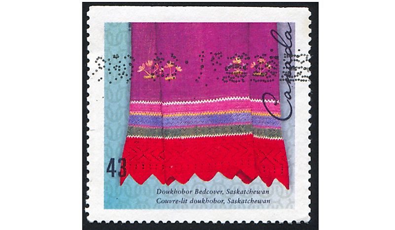 A Canadian stamp showing the Doukhobor bedspread pattern.  Editorial credit: rook76 / Shutterstock.com. 