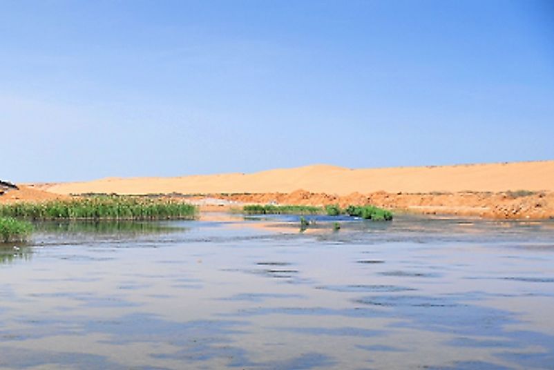 The tidal water of the Atlantic Ocean meet the desert in the Laayoune are of the northwestern Western Sahara.
