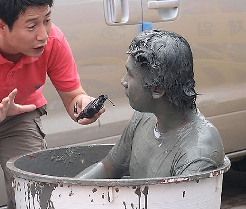 A man takes a mud bath during the 2008 edition of the Boryeong Mud Festival.