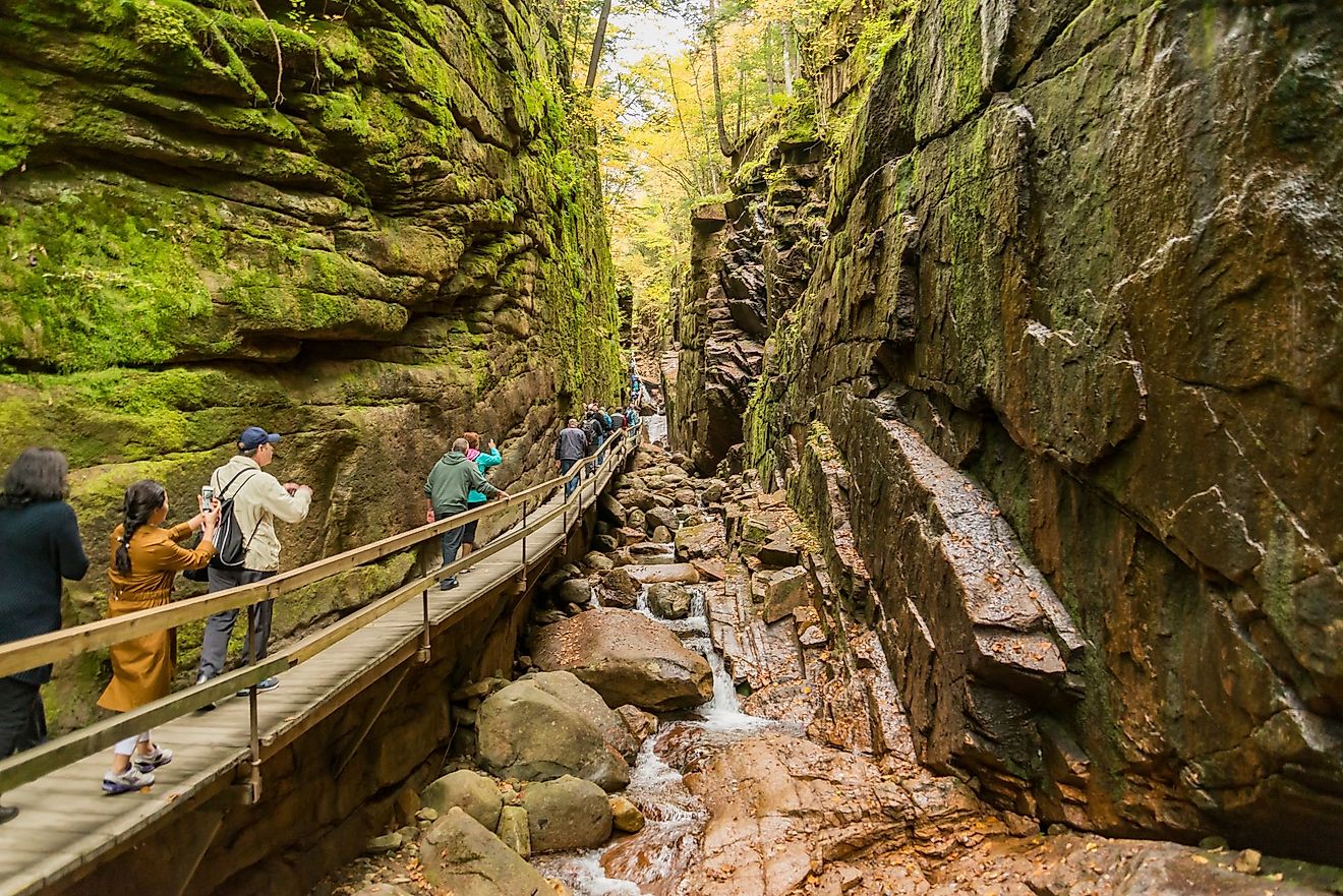 Tourists visiting the Flume Gorge during fall in Franconia Notch State Park, New Hampshire. Editorial credit: Enrico Della Pietra / Shutterstock.com
