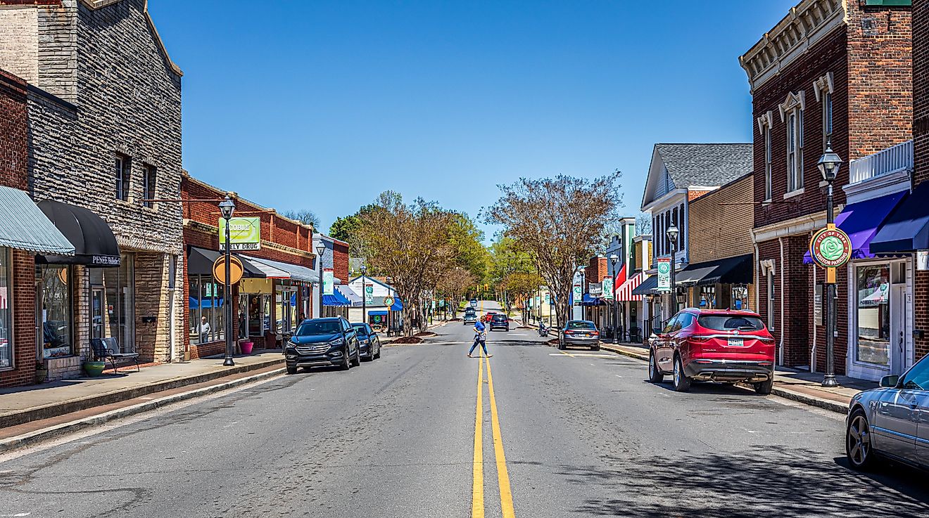 Wide-angle view of North Congress Street in York, South Carolina, on a sunny spring day, with a woman crossing the street. Editorial credit: Nolichuckyjake / Shutterstock.com