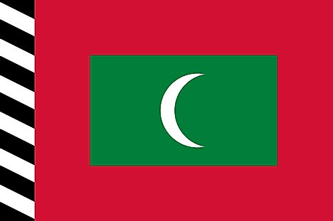 Red flag with black and white striped hoist and a green rectangle containing white crescent