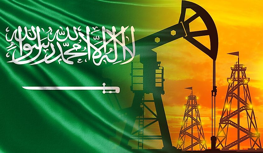 The flag of Saudi Arabia and oil rigs