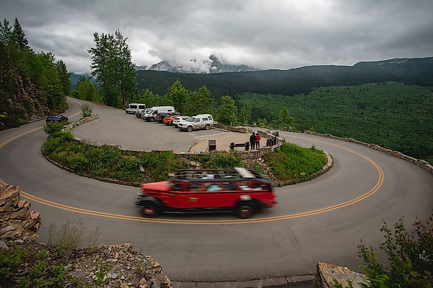 A tour bus navigates The Loop in Glacier National Park.