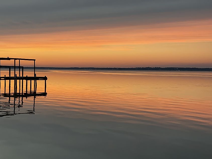 Boat dock on Perdido Bay at sunset