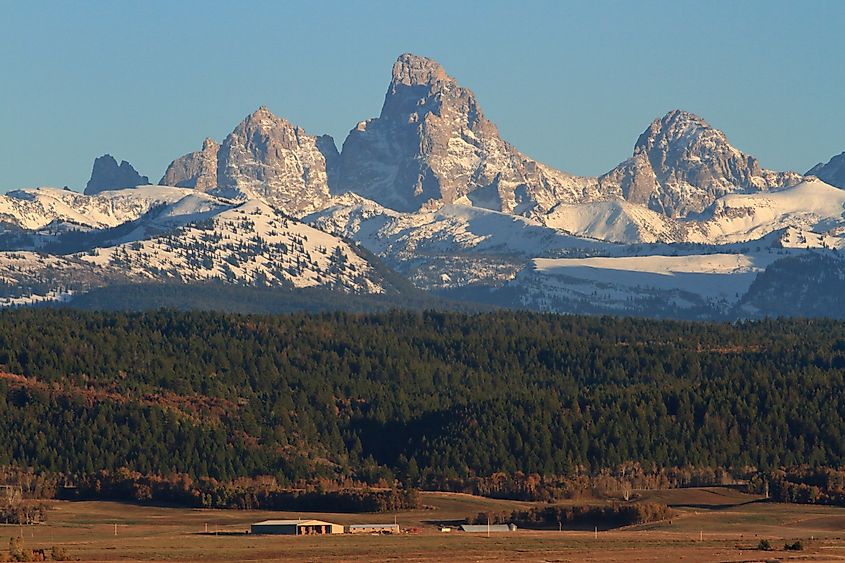 Teton Mountain range viewed from the west side near Driggs, Idaho, offering stunning vistas of the rugged peaks and surrounding landscape.