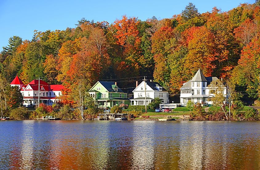 View of Saranac Lake, New York, in the Adirondack Mountains during fall. 