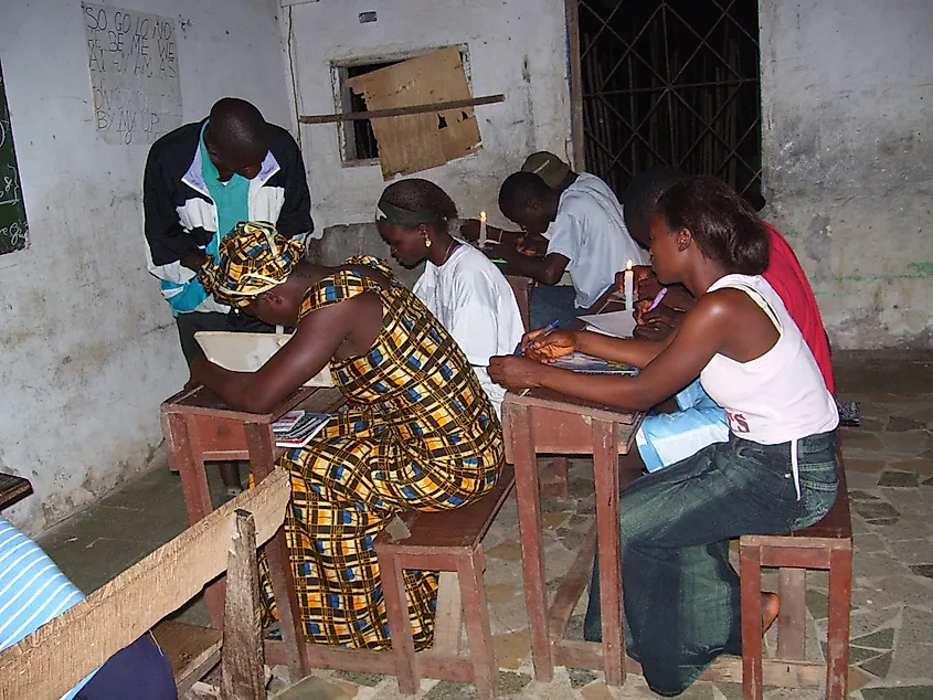 Female students students studying by candlelight in a Liberian school in Bong County.