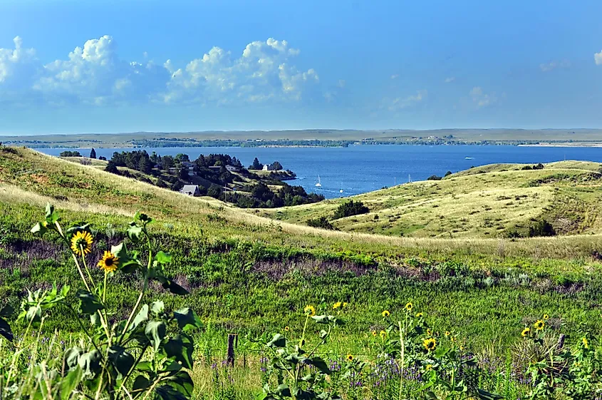 Rolling Nebraska grassland sloping down to the blue water of Lake McConaughy