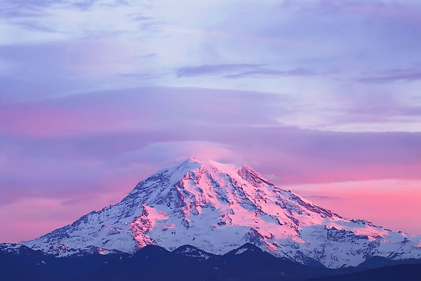 Pink sunset light on Mount Rainier in the Cascade Range, Washington