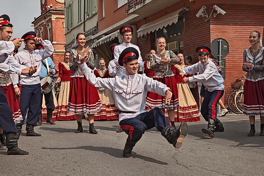 A dancer performs a traditional Cossack dance in the city street during the International Folklore Festival.