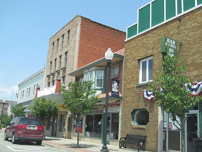 Street view of Harbor Beach, Michigan, showing a bar & grill and some shops.