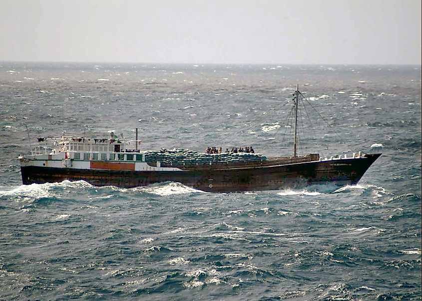 Suspected pirates assemble on the deck of a dhow in waters off western Malaysia, January 2006.