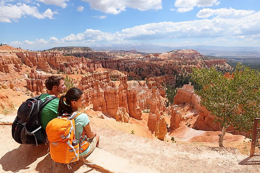 Hikers in Bryce Canyon resting enjoying view.