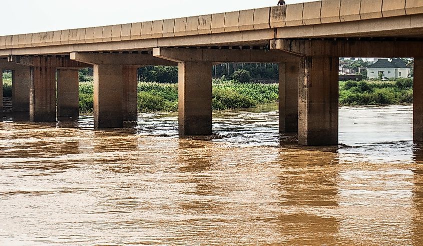 River Kaduna Bridge. A view of River Kaduna featuring the River Kaduna bridge with a passer-by atop it