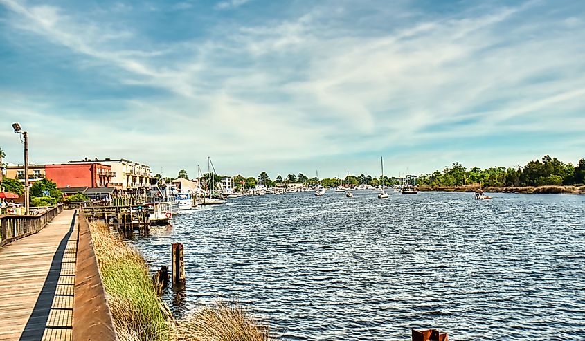 The boardwalk along the river in Georgetown, SC with the marina in the background.