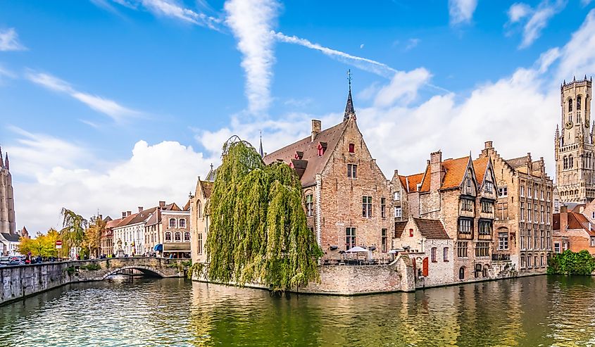 Panoramic city view with Belfry tower and famous canal in Bruges, Belgium