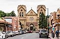 Santa Fe: downtown city street with parked cars and Cathedral Basilica of St. Francis of Assisi in New Mexico