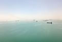 View of ships at anchor in the Great Bitter Lake at the halfway point of the Suez Canal. Image credit FabianIrwin via Shutterstock.