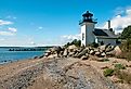 Bristol Ferry lighthouse is surrounded with large boulders to protect the keepers when the tides would rise in Narragansett Bay in Rhode Island.