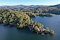 Aerial view of lake homes on the lakeshore on an autumn afternoon in Lake Santeetlah, North Carolina. Editorial credit: Francisco Blanco / Shutterstock.com