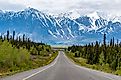 The Alaska Highway passing through the spectacular mountains of Alaska.