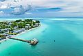 An aerial view of a fishing pier on Holmes Beach in Anna Maria Island Florida.