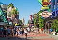 A crowd of visitors walking towards the entrance of the Universal Orlando Resort theme parks in Orlando, Florida.