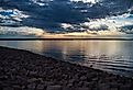 The scenic Hillsdale Lake and its rocky coast at sunset in Kansas.