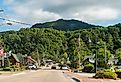 Downtown Banner Elk road street in North Carolina city town famous for Sugar and Beech Mountain ski resorts and store shops restaurants cafe trail sign. Image credit Kristi Blokhin via Shutterstock.