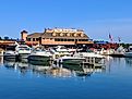 Put-in-bay, Ohio - May 27, 2018: Boats tied up at A-Dock with the famous Boardwalk restaurant in the background.