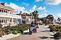 People pedal on surrey bikes past the Hotel del Coronado in Coronado, California. Editorial credit: Sherry V Smith / Shutterstock.com