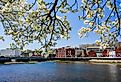 View from Westport Bridge over Saugatuck River and architecture near downtown in Westport, Connecticut. Image credit Miro Vrlik Photography via Shutterstock