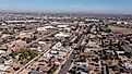 Afternoon aerial view of the downtown skyline and surrounding housing of Peoria, Arizona