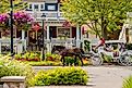 A horse-drawn carriage transports tourists in downtown Frankenmuth, Michigan. Image credit arthurgphotography via Shutterstock.com