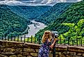 Enjoying the view from Hawks Nest State Park which offers an expansive view of the New River Gorge, West Virginia. Image credit Malachi Jacobs via Shutterstock