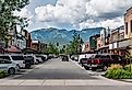 Main Street view of Whitefish, Montana with mountains in the background. Image credit Beeldtype via Shutterstock.