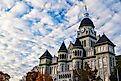 Carthage, Missouri, USA - November 4, 2021: The Carthage Courthouse with fall foliage downtown in one of the best small towns in Missouri. This is one of the most photographed buildings in Missouri.