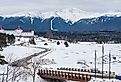 A distant view of Mount Washington, New Hampshire during winter, with the Omni Mount Washington Resort in the foreground.