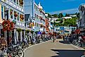 Crowded street view of Mackinaw Island Michigan during the busy tourist season. Editorial credit: Dennis MacDonald / Shutterstock.com