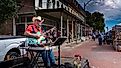 A country folk singer performing during the fall festival in Lebanon, Illinois. Editorial credit: RozenskiP / Shutterstock.com