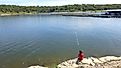 Boy fishing in Lake Texoma at Eisenhower State Park in Texas