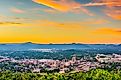 Roanoke, Virginia, downtown skyline from above at dusk. 