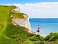 White chalk cliffs and Beachy Head Lighthouse. Eastbourne, East Sussex, England