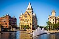 Downtown Syracuse New York with view of historic buildings and fountain at Clinton Square.