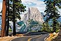 The road leading to Glacier Point in Yosemite National Park, California, USA with the Half Dome in the background. Image credit Tom Nevesely via AdobeStock.