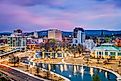 Huntsville, Alabama, USA park and downtown cityscape at twilight.